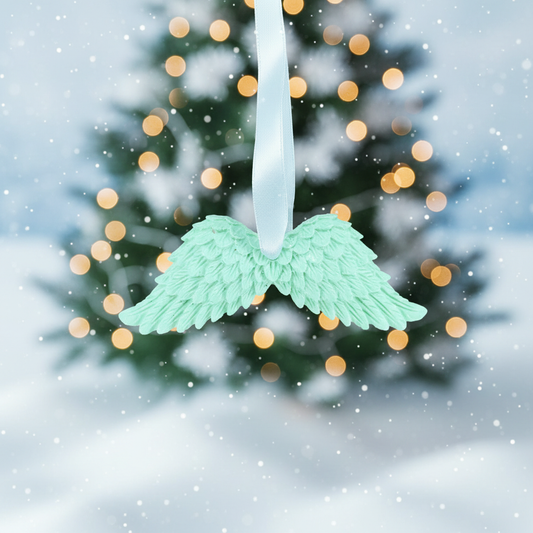 Angel wing decoration with Christmas tree background