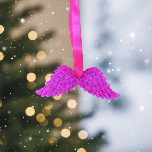 Bright pink angel wings with festive background