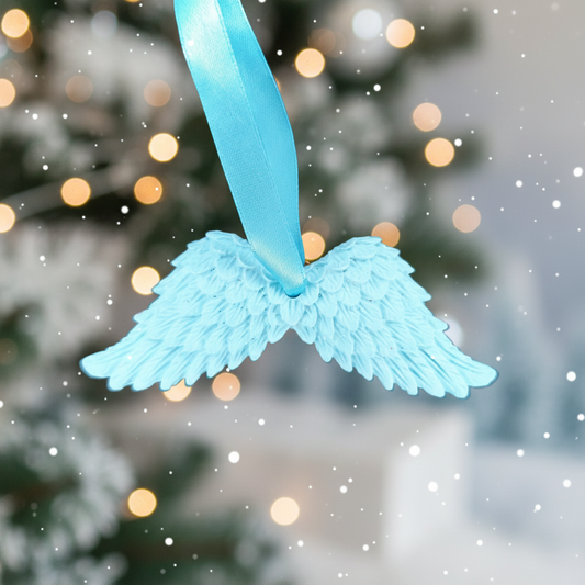Pale blue angel wings with festive background