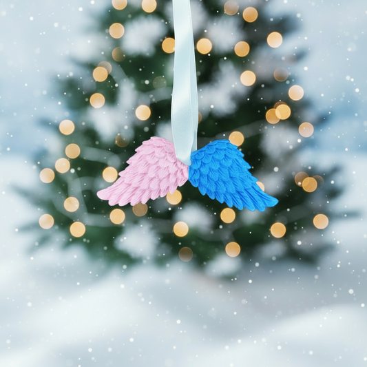 Pink and blue angel wings with festive background