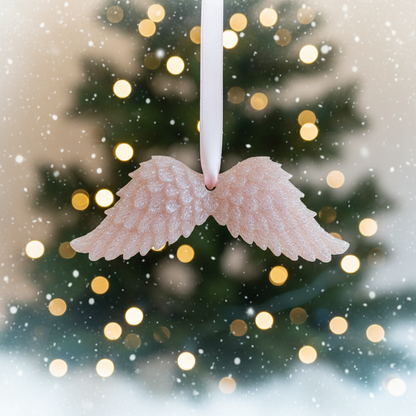 Pink and white glitter angel wings with festive background
